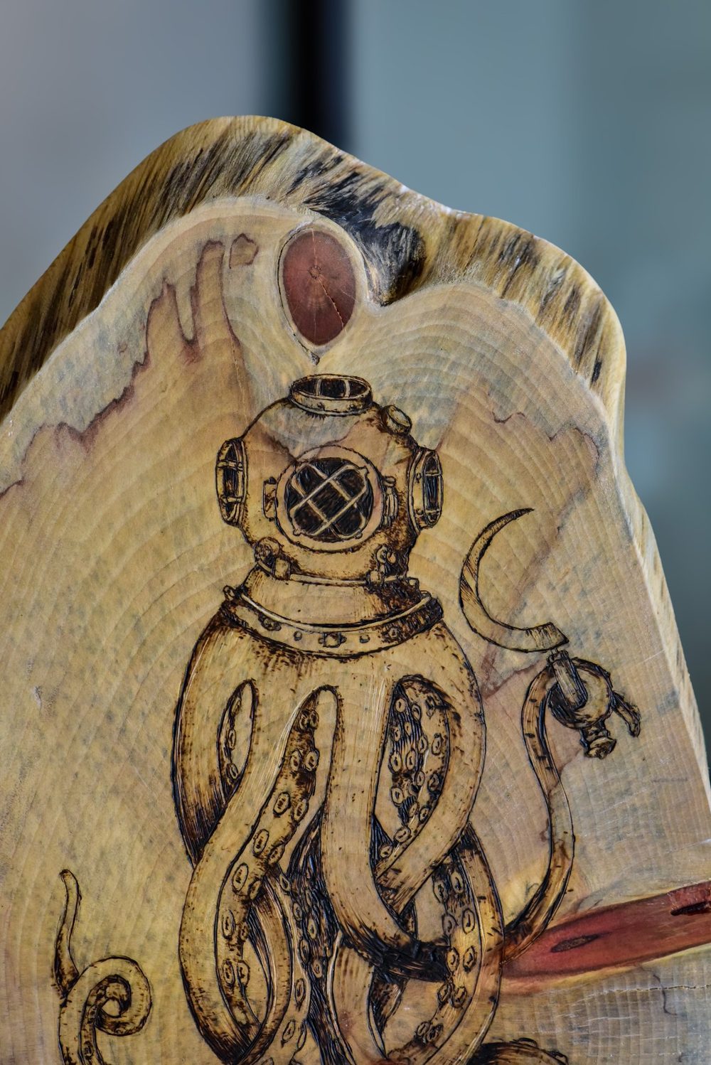 Distorted Reality — detail: the riveted diving helmet and suckered tentacles