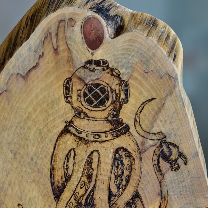 Detail of Distorted Reality: the riveted diving helmet and suckered tentacles