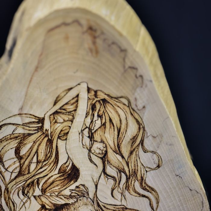 Detail of The Siren's Call: strands of hair burned in flowing lines